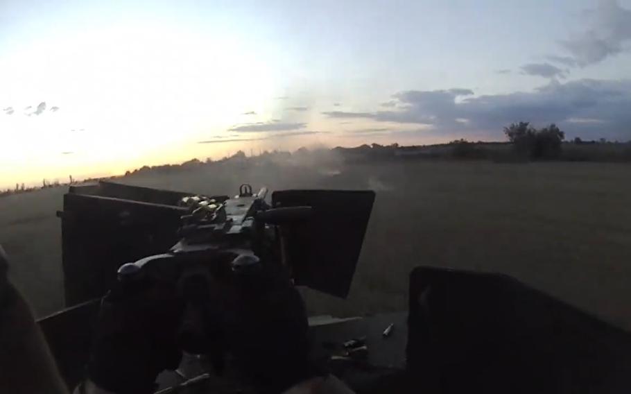 A set of first-person videos filmed Thursday in southern Ukraine shows a gunner mounted atop an armored Humvee, furiously firing a .50-caliber M2 Browning machine gun and raking nearby buildings with rounds roughly the size of cigars.