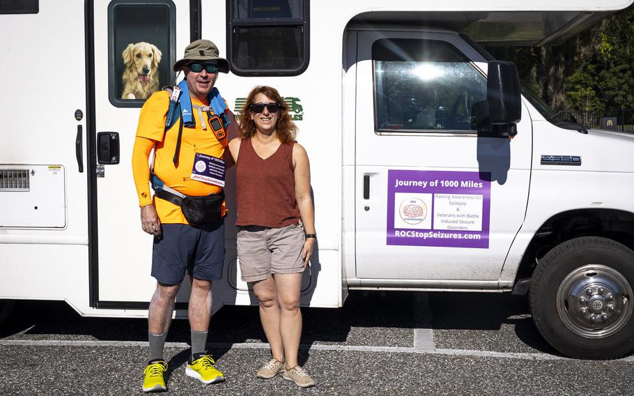 Ryan “ROC” O’Connor stands with his wife, Marissa O’Connor, before embarking on day two of his Journey of 1,000 Miles in Mount Dora, Fla., on Oct. 2, 2022.