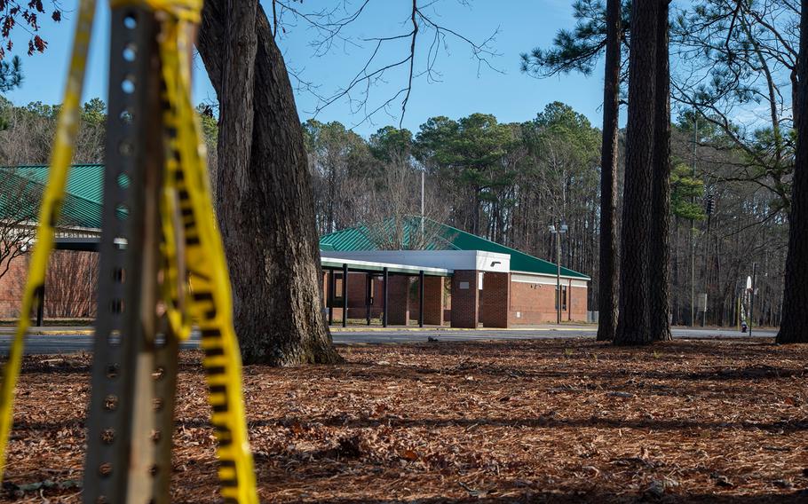 Police tape hangs from a signpost outside Richneck Elementary School following a shooting on Jan. 7, 2023, in Newport News, Va. A 6-year-old student was taken into custody after shooting a teacher during an altercation in a classroom at Richneck Elementary School.