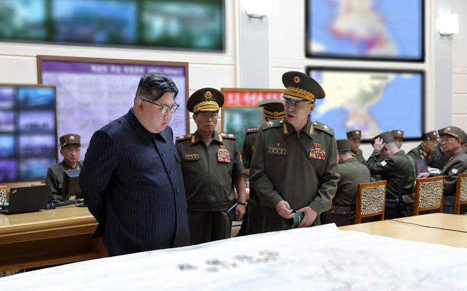 North Korean leader Kim Jong Un meets with senior military officials in this undated photo issued recently by the Korean Central News Agency. 