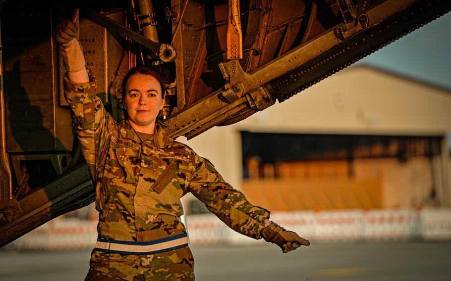 Air Force Capt. Samantha Stilwell, 86th Aeromedical Evacuation Squadron medical crew director, gives litter-bearers the go-ahead to board a C-130H Hercules during a medical evacuation exercise June 6, 2023, at Ramstein Air Base, Germany.