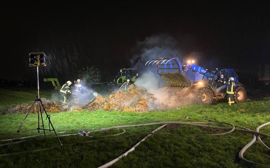 German and American crews extinguish a fire in Delkenheim, Germany, early Tuesday, Dec. 28, 2021. U.S. Army firefighters from Wiesbaden provided assistance with their airfield firetruck, which has a large-capacity water storage tank. 