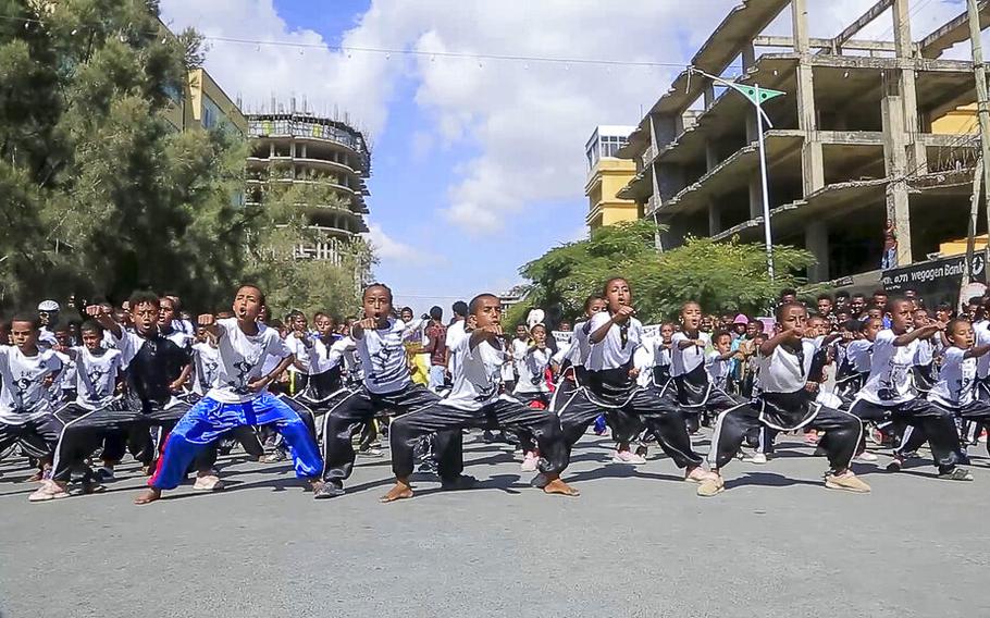Children from a local martial arts center perform in Mekele, the capital of the Tigray region, in northern Ethiopia on Nov. 26, 2022, during a celebration of a peace deal agreed between the Ethiopian federal government and Tigray forces.
