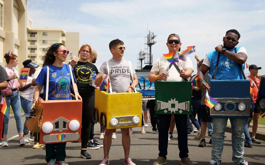 Service members and civilians gather for a Pride Day parade at Yokosuka Naval Base, Japan, Wednesday, June 28, 2023.