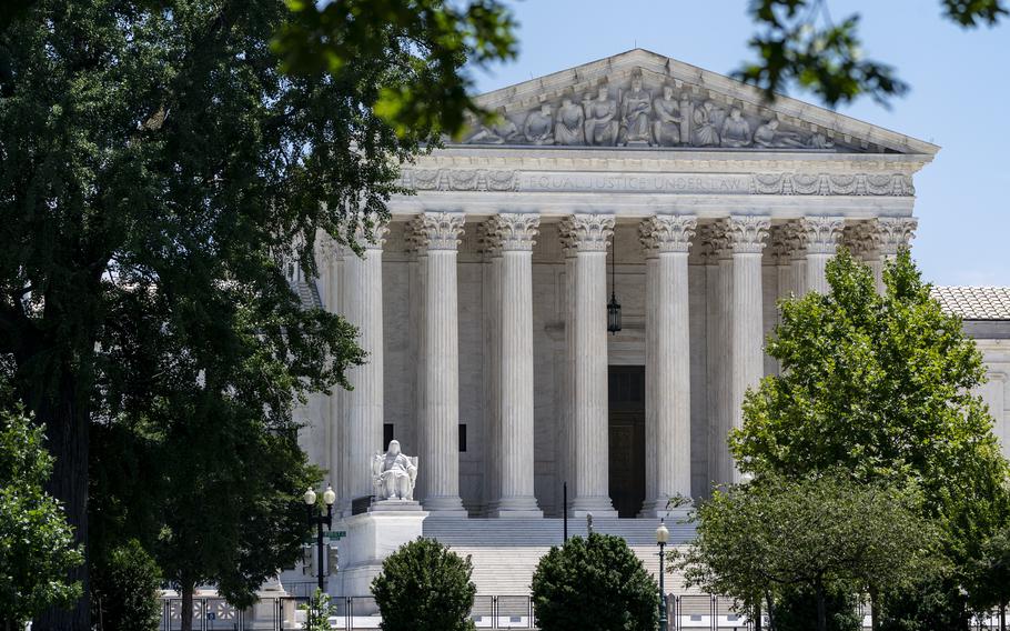 The Supreme Court is seen on Capitol Hill in Washington, July 14, 2022. The Supreme Court ruling expanding gun rights threatens to upend firearms restrictions across the country as activists wage court battles over everything from bans on AR-15-style guns to age limits.