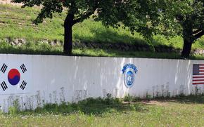 A mural on the South Korean side of the Demilitarized Zone shows the South Korea, U.N. Command and American flags on May 9, 2023.