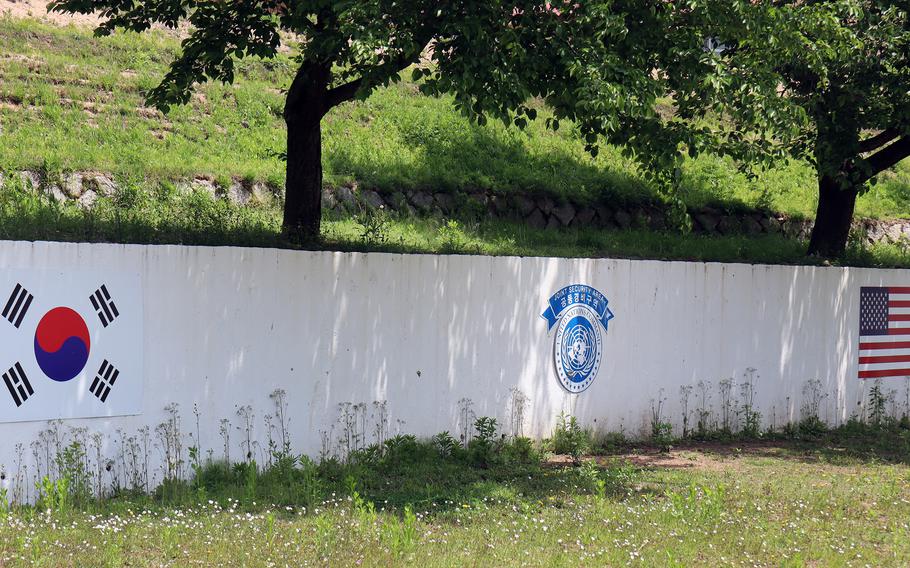 A mural on the South Korean side of the Demilitarized Zone shows the South Korea, U.N. Command and American flags.