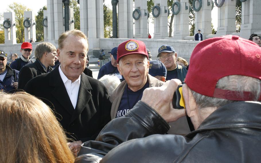 Former Sen. Bob Dole, R-Kan., meets with Honor Flight participants at the National World War II Memorial in Washington, D.C., in 2007.