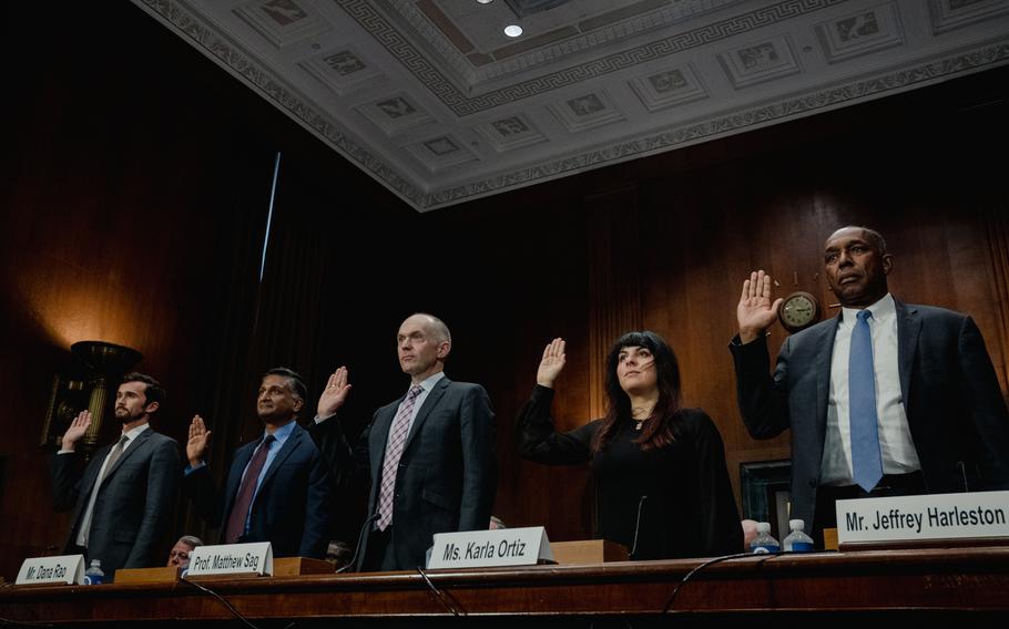 Witnesses are sworn in at a Senate subcommittee hearing on issues of artificial intelligence, intellectual property and copyright in Washington on Wednesday. 