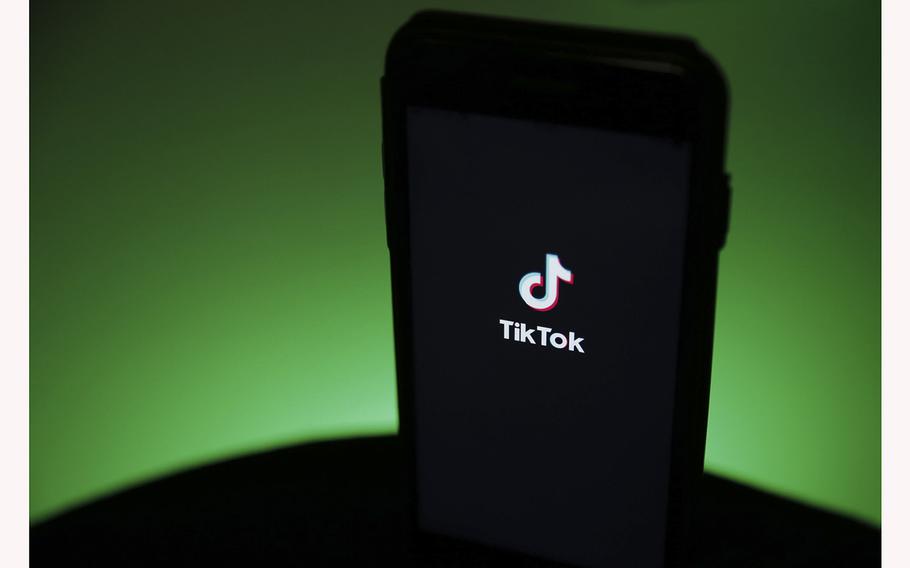 The TikTok logo is displayed on a smartphone in this arranged photograph in London, U.K., on Aug. 3, 2020. 