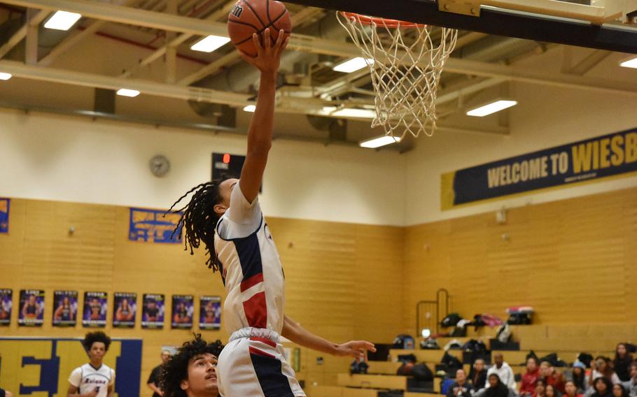 Aviano’s Andrew Walker goes up for a basket in the Saints’ loss to Black Forest Academy on Wednesday, Feb. 14, 2024, at the DODEA European Division II Basketball Championships in Wiesbaden, Germany.