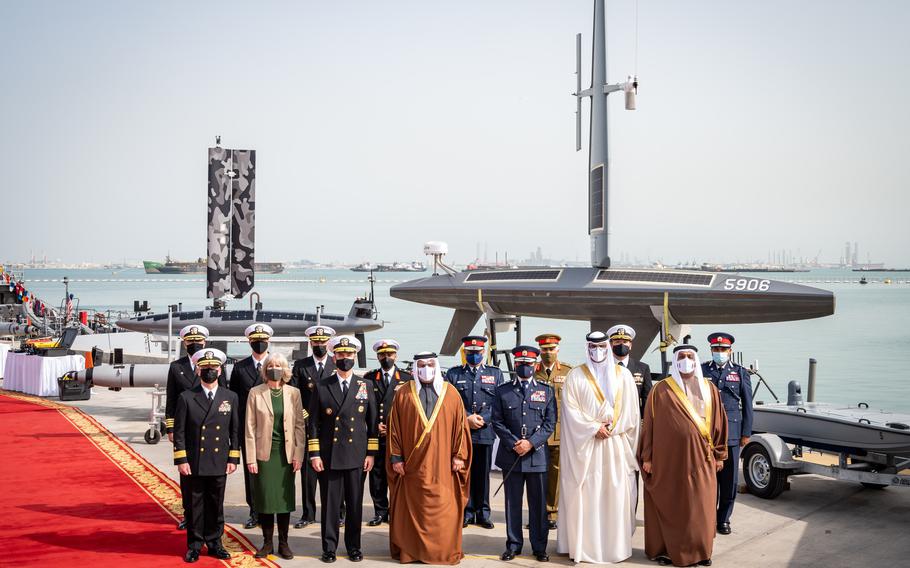 The crown prince of Bahrain, Salman bin Hamad Al-Khalifa, and various dignitaries from the U.S. and Bahrain stand for a group photo at Naval Support Activity Bahrain on Jan. 31, 2022.