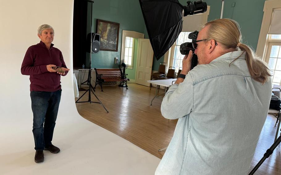 Photographer Jason Grow photographs Vietnam War Army veteran Sgt. Tom Piraino of Gloucester, Mass., as part of his to photograph Vietnam and Korean War veterans. 