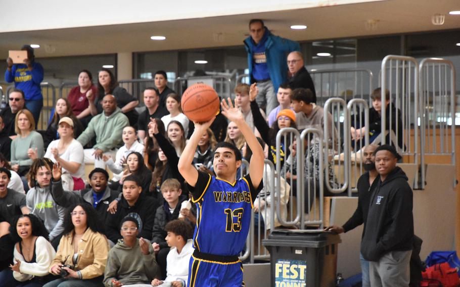 Wiesbaden’s Yadier Viera tries a three-point shot Friday, Feb. 16, 2024, in a Division I semifinal game at the DODEA European Basketball Championships at Wiesbaden, Germany.