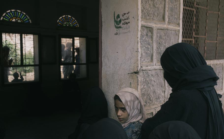 Women from several villages in the Maghrabah district of Yemen gather at the village school in Moulis, where food is distributed by the World Food Program. 