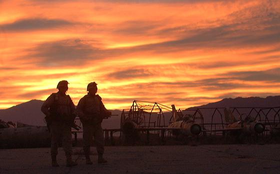  Two 10th Mountain Division soldiers head out for an early morning patrol at Bagram Airfield, Afghanistan, in December 2001. It was announced July 2, 2021, that the last U.S. troops had left Bagram, nearly 20 years after they first arrived.