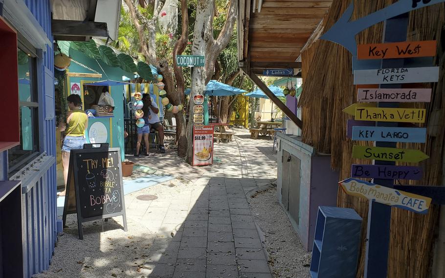 A view of the street and some shops and cafés at Rain Barrel Village in Islamorada, Fla.