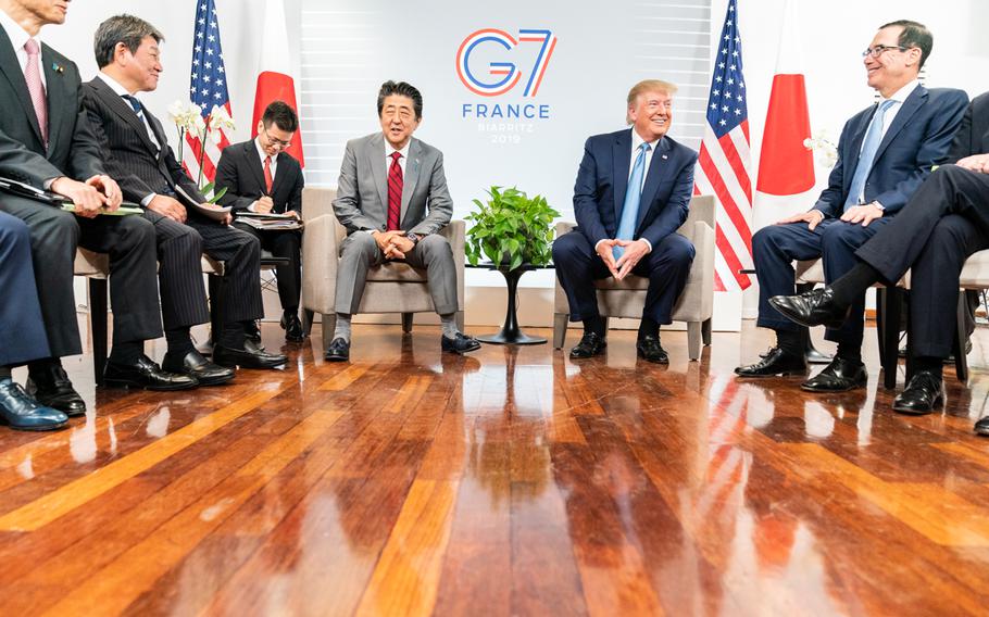 Then-President Donald J. Trump and then-Prime Minister of Japan Shinzo Abe, joined by their delegation members, participate in a bilateral meeting at the Centre de Congrés Bellevue Sunday, Aug. 25, 2019, in Biarritz, France, site of the G7 Summit.