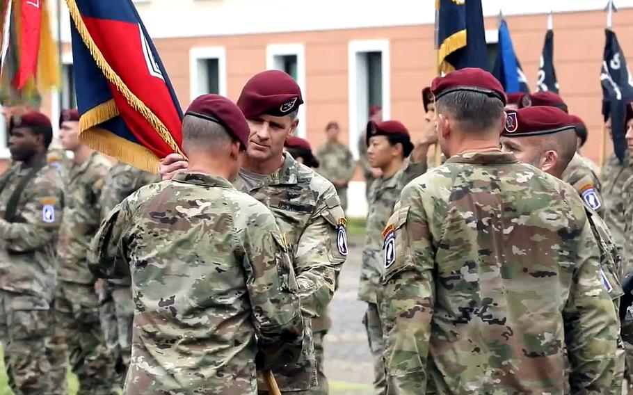 Col. Joshua Gaspard takes the colors of the 173rd Airborne Brigade from Maj. Gen. Todd Wasmund, commanding general of the U.S. Army Southern European Task Force, Africa at a July 6, 2023, change of command ceremony in Vicenza, Italy.
