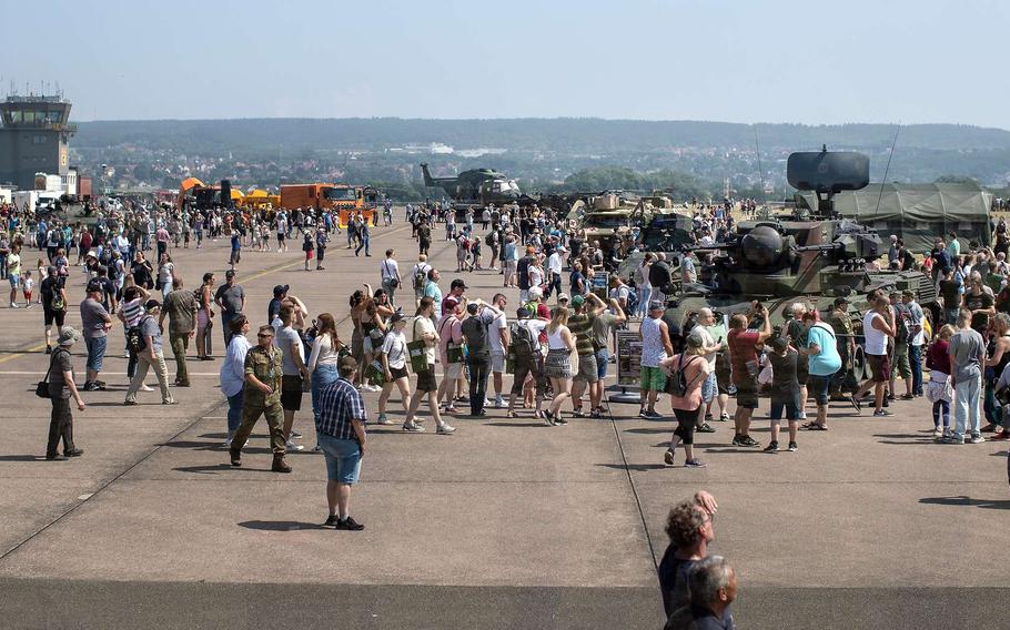 Visitors flock to see German military equipment, including the Gepard anti-aircraft gun tank, right, at German Armed Forces Day in Muenster, Germany, in 2023. According to a new poll, more than half of Germans would be unwilling to fight for their country if it came under attack, and 75% don't think the German army would be up to the task.