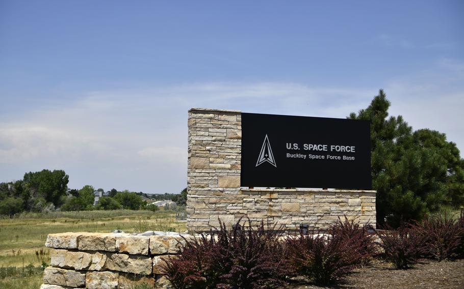 Signs greet personnel at the south entrance to Buckley Space Force Base in Aurora, Colo., in July 2021.