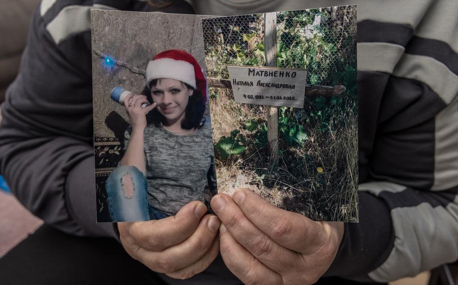 A woman holds up two pictures, one of her daughter and another of a grave.