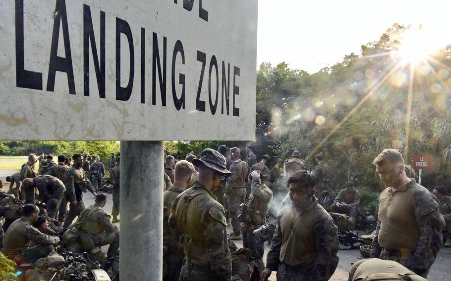 Marines from Alpha Company, 1st Battalion, 2nd Marine Regiment out of Camp Lejeune, N.C., prepare for an exercise at the Central Training Area on Okinawa, Dec. 7, 2022.