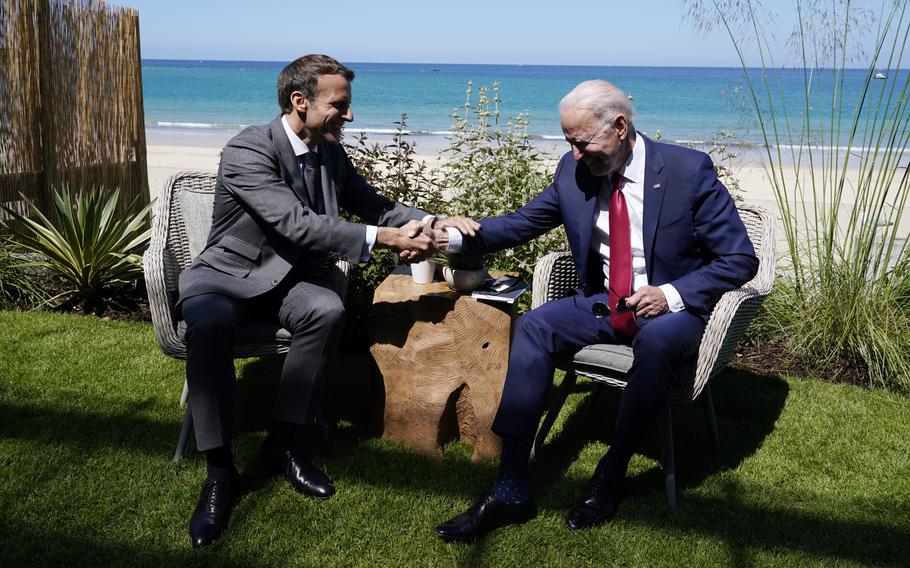President Joe Biden and French President Emmanuel Macron visit during a bilateral meeting at the G-7 summit, Saturday, June 12, 2021, in Carbis Bay, England.