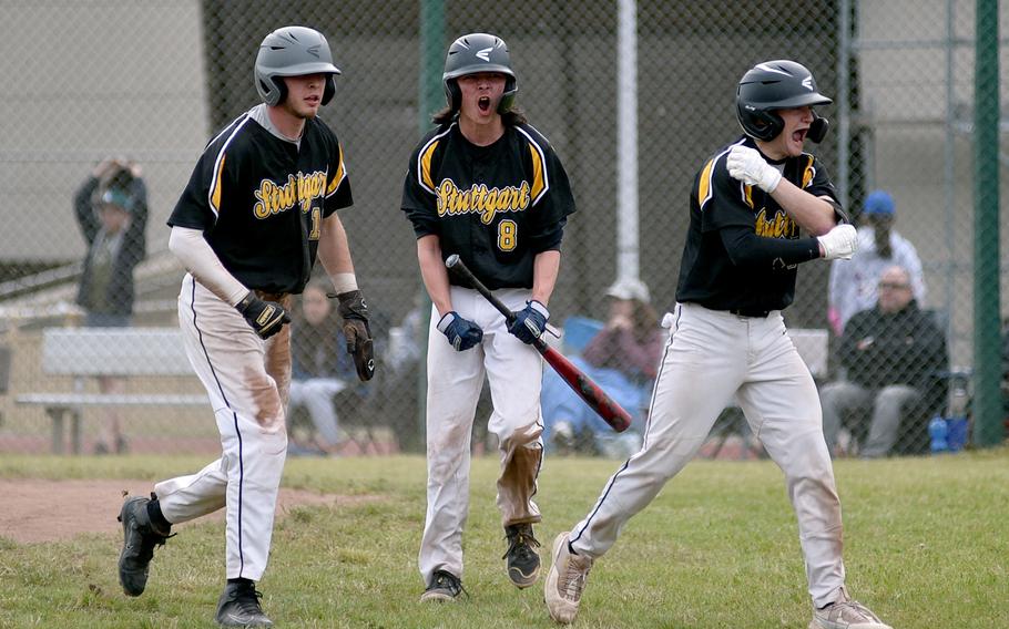 From left, Stuttgart's Josh Zipperer, Jamie Arnold and Caiden Ray after Arnold and Zipperer scored in the bottom of the sixth inning during the Division I DODEA European baseball semifinal against Wiesbaden on May 19, 2023, at Southside Fitness Center on Ramstein Air Base, Germany. The Panthers won, 8-7.