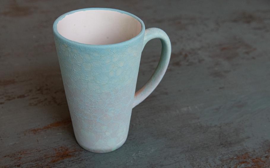 A freshly painted mug before being glazed and fired at Lauter Atelier in Kaiserslautern on Feb. 27, 2024.