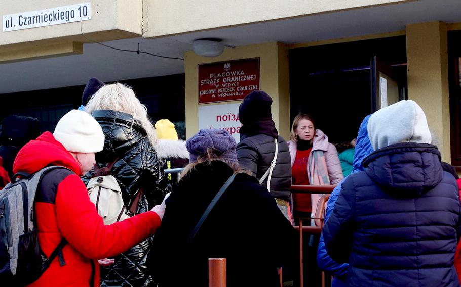 At the train station in Przemysl, just inside Poland near the Ukraine-Poland border, passengers wait to board a train to Kyiv on March 12.