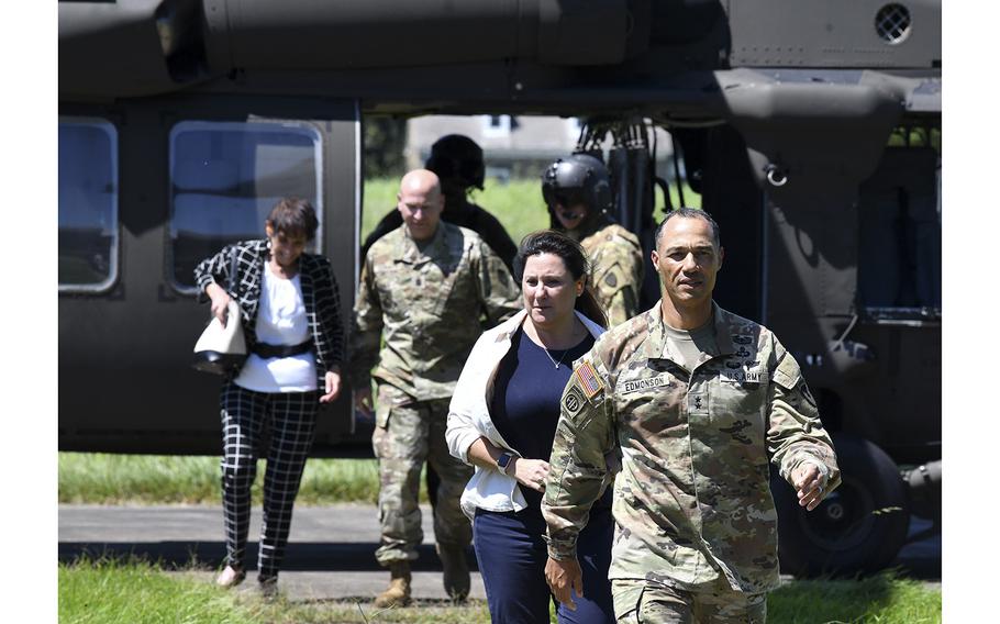 Maj. Gen. Robert Edmonson, front and Maryland Del. Mary Ann Lisanti, center, along with Mary Ann Jernigan, Civilian Aide to the Secretary of the Army for Maryland, back left, and Command Sgt. Maj. Michael Conaty, exit the Maryland National Guard helicopter after landing at Plum Point on Aberdeen Proving Ground following a tour of the installation during an Immersion Day at the post, on August 22, 2022.