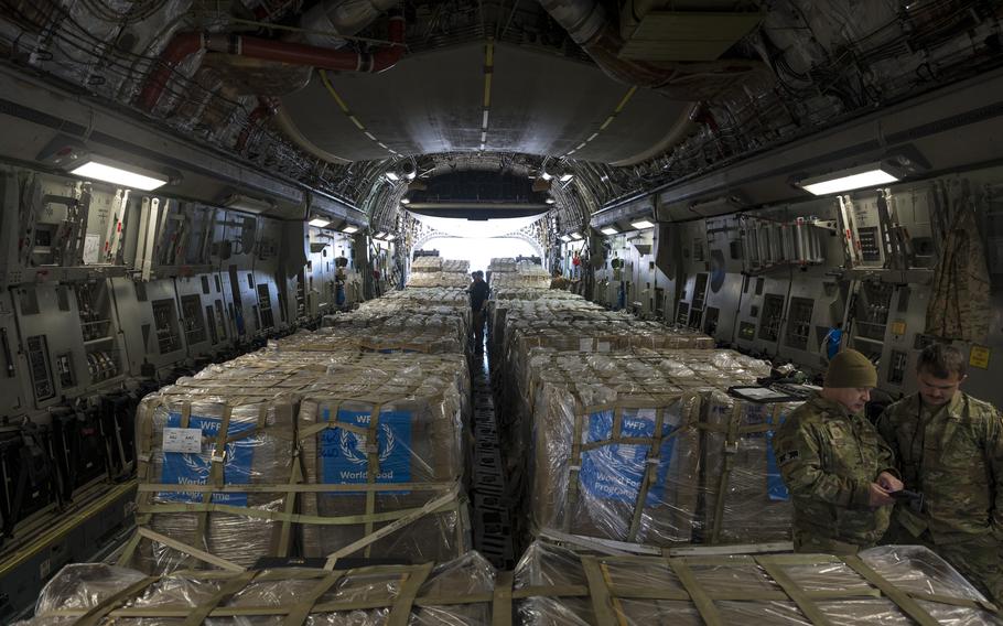 A U.S. Air Force C-17 Globemaster III carries nearly 58,000 pounds of humanitarian aid to provide vitally needed medical supplies, warm clothing, food and nutrition assistance to the people of Gaza from undisclosed locations throughout the Middle East, Dec. 8, 2023.
