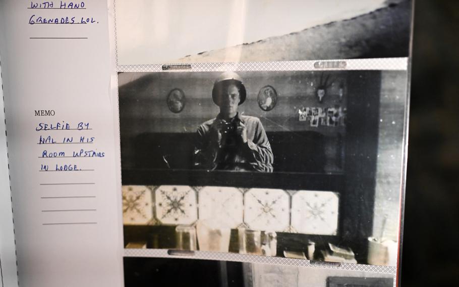 A black and white photo of Harold “Hal” Urban is seen in a photo album.