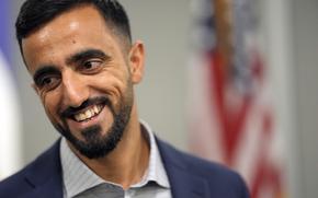 Abdul Wasi Safi smiles after a news conference Friday, Jan. 27, 2023, in Houston. Wasi Safi, an intelligence officer for the Afghan National Security Forces who fled Afghanistan following the withdrawal of U.S. forces, was freed this week and reunited with his brother after spending months in immigration detention.