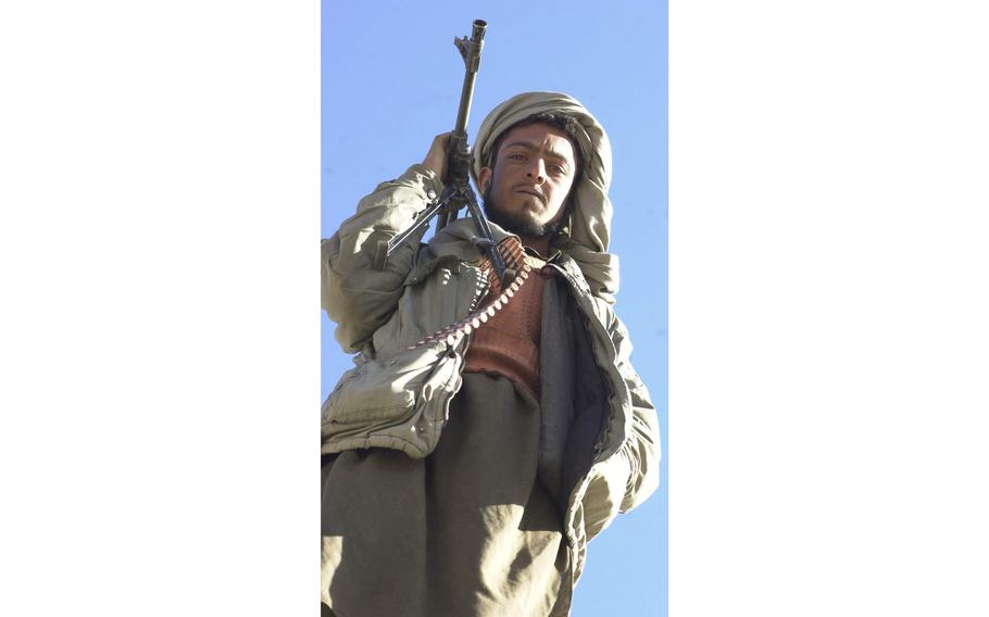 A Taliban fighter looks on as Northern Alliance forces take control of Jalreez [Jalrez] Nov. 25, 2001, the last pocket of Taliban-controlled territory immediately outside of the capital city of Kabul.