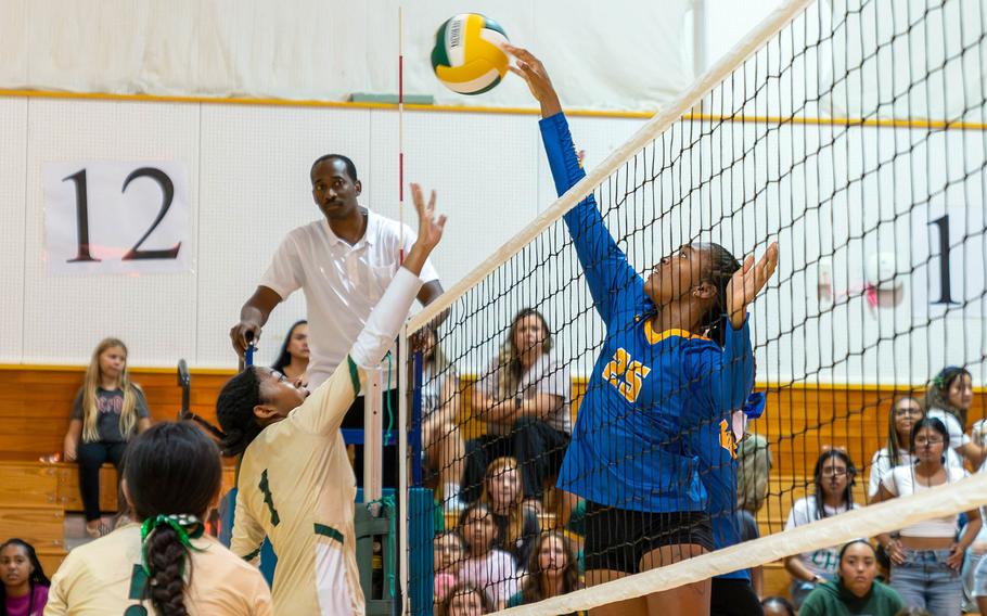 Yokota's Trinity Stegall sends the ball across the net against Robert D. Edgren's Nia Tyler. The Panthers won in four sets.