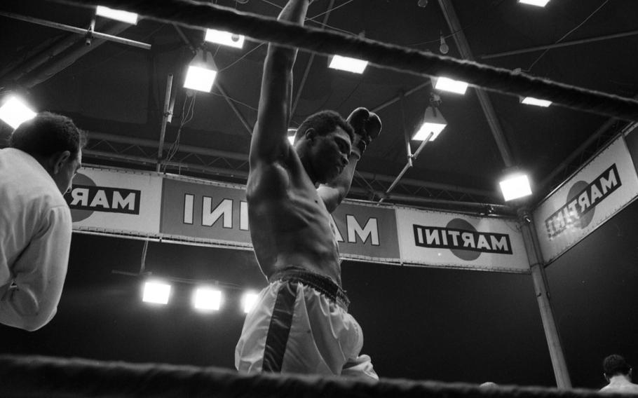 Muhammed Ali raises his arms in victory as he retained his heavyweight title with a technical knockout (TKO) in minute 1:30 of the 12th round. It was Ali's sixth successful defense of his world title.