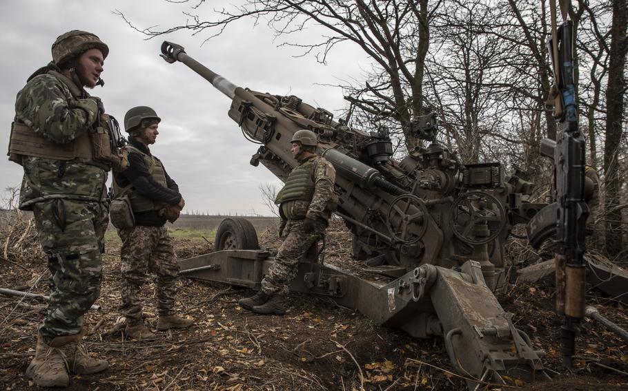 A Ukrainian artillery unit fires an M777 howitzer at Russian armored vehicles near the town of Snihurivka in Ukraine’s southern Mykolaiv region on Nov. 9, 2023.