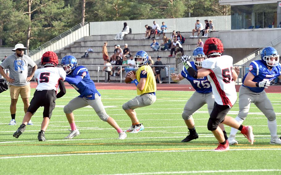 Royal quarterback Lucas Hollenbeck stares down a passing lane during a scrimmage against Kaiserslautern on Aug. 25, 2023, at Ramstein High School on Ramstein Air Base, Germany.