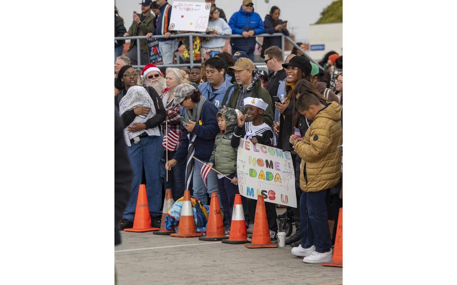 Families and friends welcome home sailors assigned to amphibious assault carrier USS Tripoli (LHA 7), Tuesday, Nov. 29, 2022.