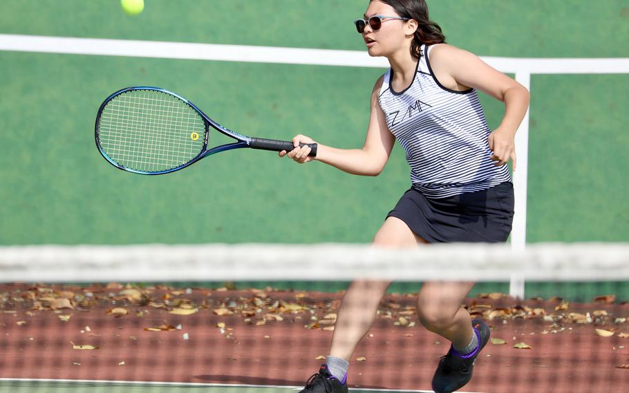 Zama's Jessie Teegarden readies a forehand return against Robert D. Edgren's Alyssa Singletary. Singletary won the singles match 8-0 and teamed with Abby Erler to beat Teegarden and Jolie Nguyen 8-2 in doubles.