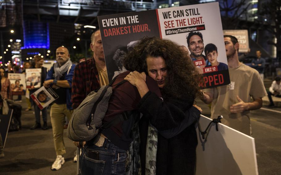 Protesters demand the Israel government agree the release of hostages with Hamas outside the Defense Ministry in Tel Aviv on Nov. 21, 2023. 