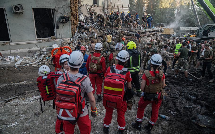Rescue and military forces clear the rubble of the destroyed building of Ohmatdyt Children’s Hospital following a missile strike in Kyiv, Ukraine, on Monday, July 8, 2024. Russia launched more than 40 missiles at several cities across Ukraine in an attack that killed at least 33 people. 