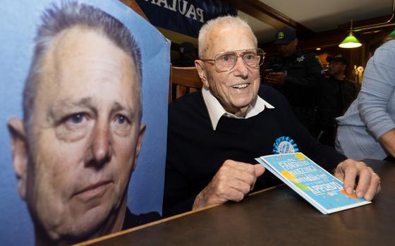 Retired Oakland police officer Toft Jessen and a portrait of him as a younger officer.