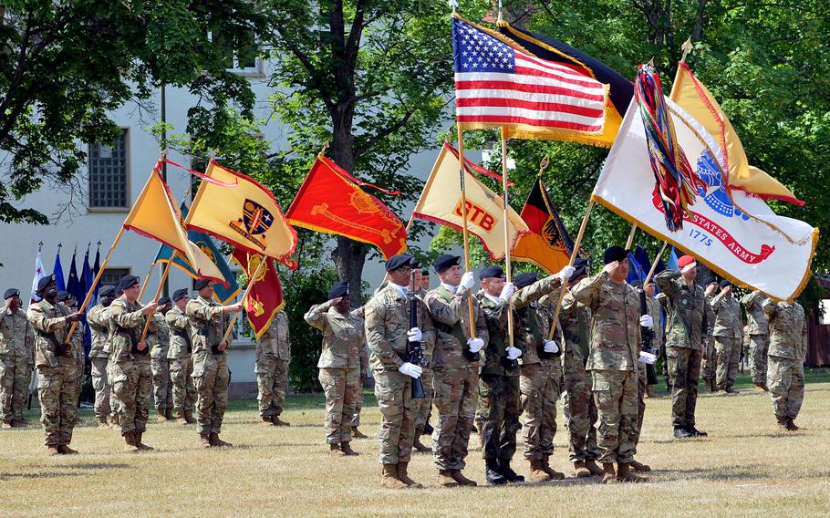 The 21st Theater Sustainment Command color guard and units of the command, on Daenner Kaserne’s NCO Field during a change of command ceremony in Kaiserslautern, Germany, on Wednesday, June 7, 2023.