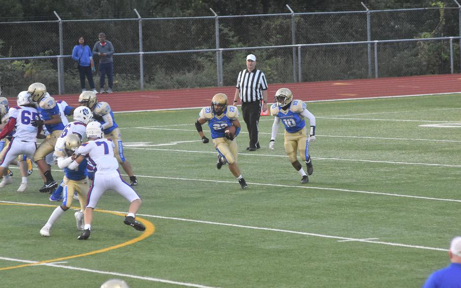 Wiesbaden running back Nick Cardona attemps to get around the Ramstein defense on Friday, Sept. 17, 2021,  during a football game in Wiesbaden.