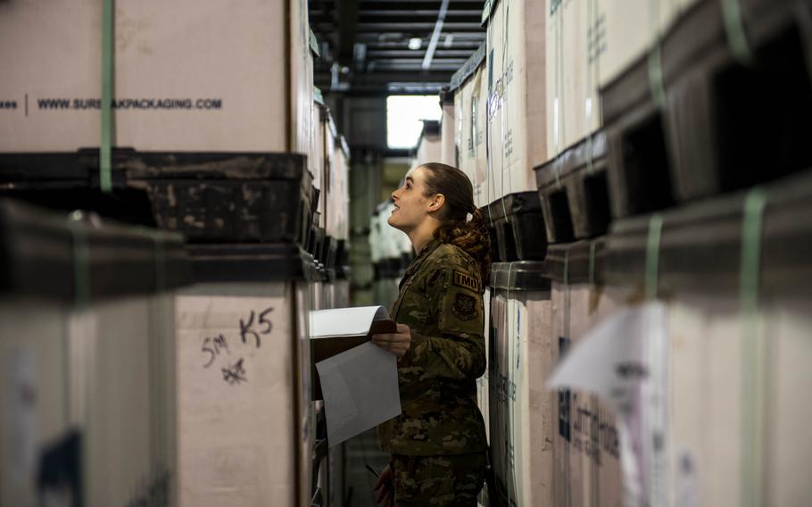 Airman Katlyn Forck, a truck dock specialist, processes shipments of body armor and helmets bound for Ukraine at Dover Air Force Base, Del., on March 8, 2022. 