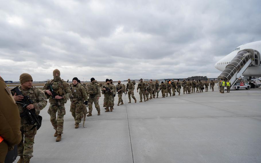 Soldiers assigned to the 82nd Airborne Division depart a Boeing 747 aircraft in Rzeszów-Jasionka Airport, Poland, on Feb. 8, 2022. The 82nd Airborne Division specializes in parachute assaults in austere environments.