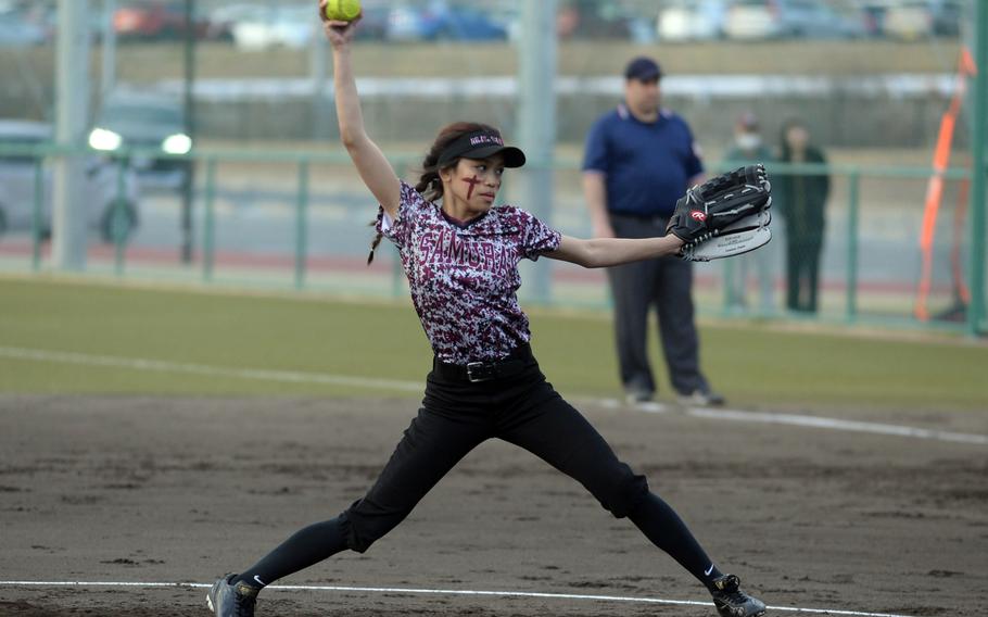 Matthew C. Perry's Ella Mhay Dixon kicks and delivers against E.J. King during Friday's DODEA-Japan softball game. The Samurai won 10-6 and later tied Canadian Academy 3-3.